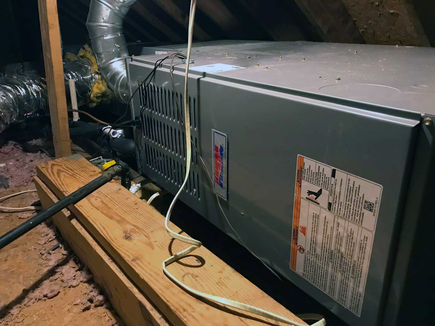 air handler getting installed by a technician